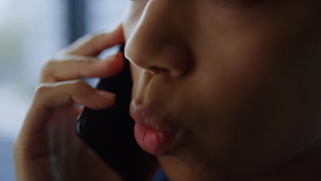 closeup afro businesswoman talking on mobile phone