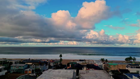 manhattan beach neighborhood with houses built on scenic coastline, aerial riser