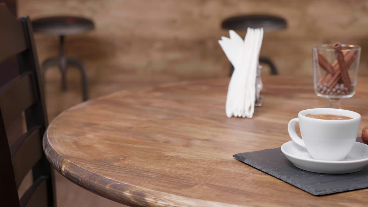 Coffee and Croissant on a Wooden Table