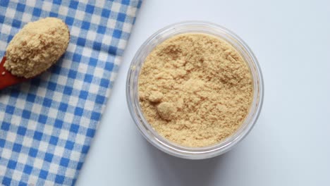 coconut sugar in a white bowl on table ,