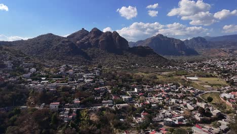 oaxtepec and tlayacapan in morelos, with rugged mountain backdrop, aerial view