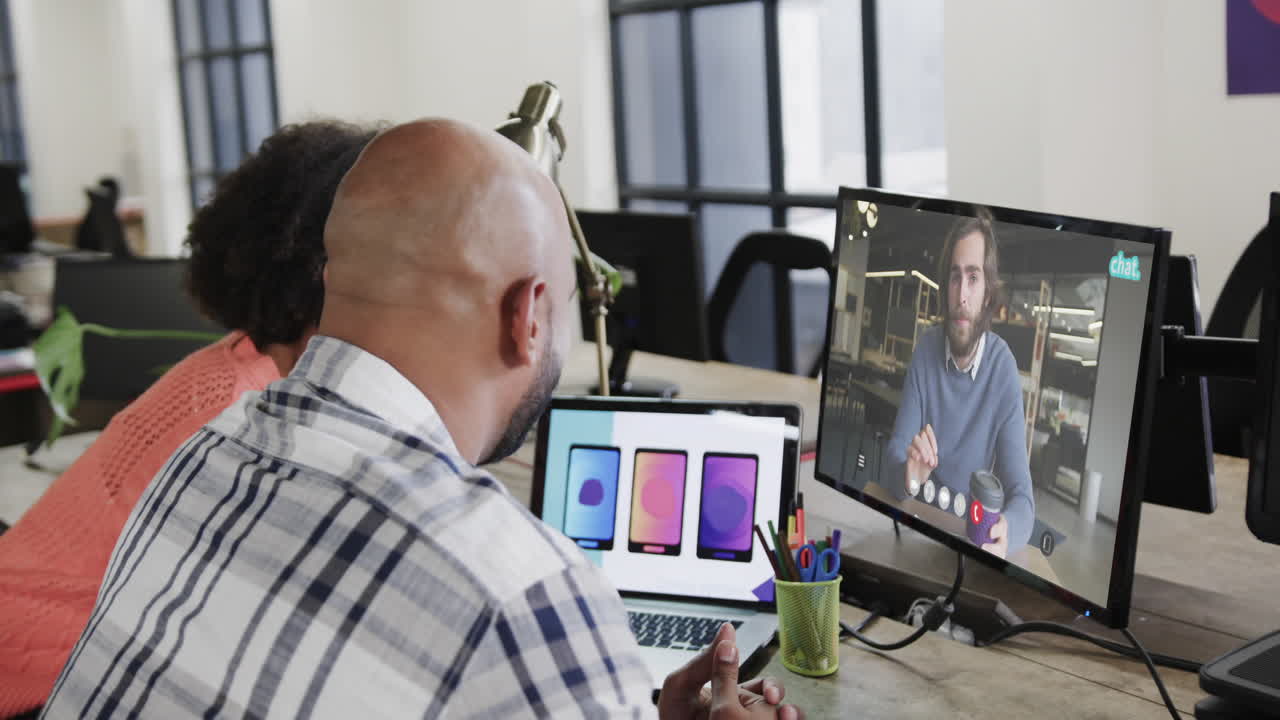 African american business people on video call with caucasian male colleague on screen