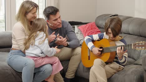 family music time: child playing guitar at home