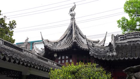Ornate Traditional Chinese Temple Roof with Bird Statue