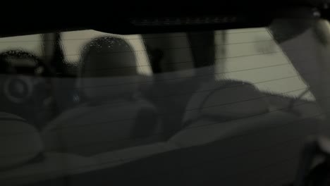 2020 mini cooper seen through rear window being cleaned for window tint