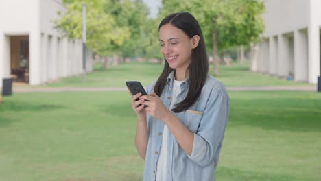 Happy-Indian-girl-chatting-with-someone