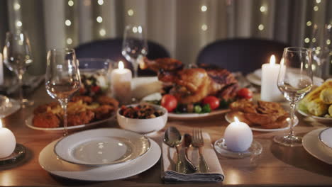 Thanksgiving-holiday-table-with-turkey-in-the-center-of-the-table