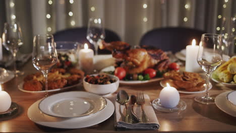 thanksgiving holiday table with turkey in the center of the table