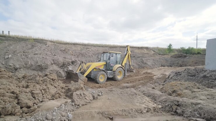 Excavation tractor works, compaction of the soil