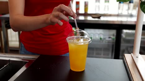 woman serving iced orange juice