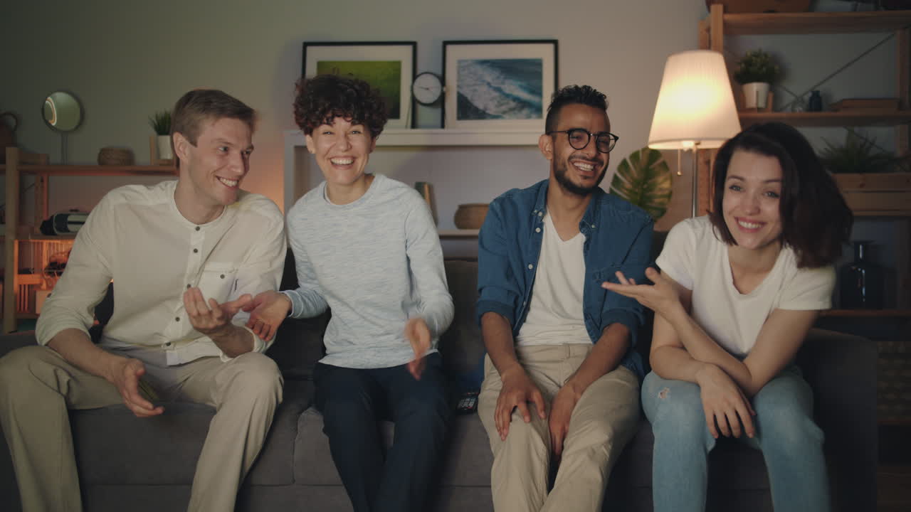 Friends Watching TV and Laughing