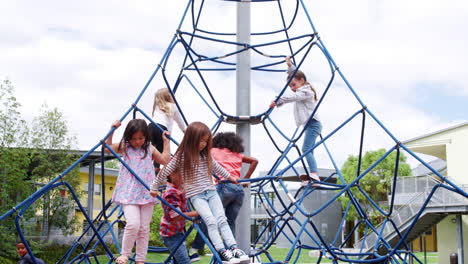 elementary school kids climbing in the school playground