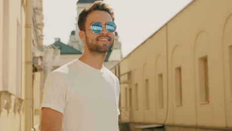 stylish man in sunglasses in a city street