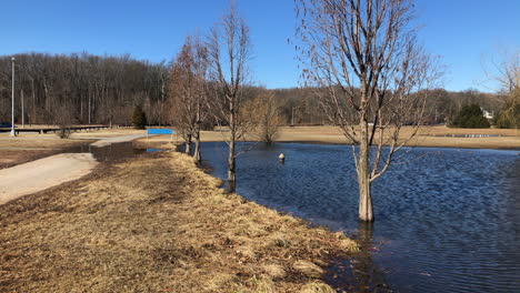 flooded walk path and grass area in wolfe's pond park
in staten island new york