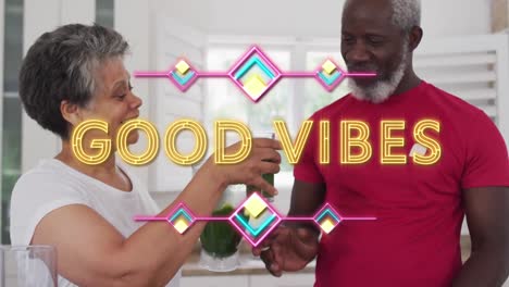 neón buenas vibraciones texto contra mujer afroamericana dando batido de verduras a su marido en casa