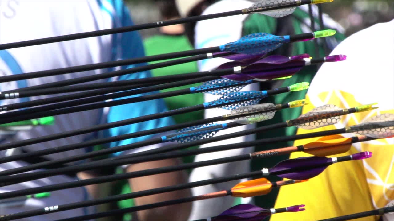 Slow motion of arrows hitting the target