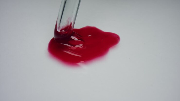 Blood drop on white surface