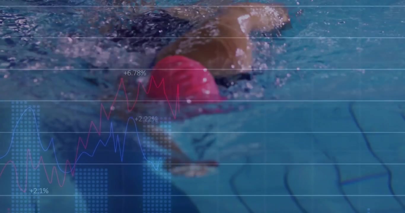 Swimming woman doing freestyle along lane starting submerged, training with pink cap and dark suit