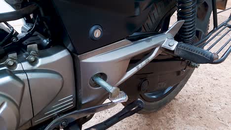 two wheeler motorbike maintenance at day from flat angle in details