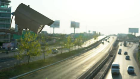 footage of cctv surveillance camera operating on traffic road in afternoon sunset