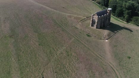 Forward-tracking-aerial-over-St-Catherine's-Chapel-near-Abbotsbury,-Dorset