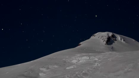 closeup of summit with the stars behind it