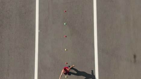 teenager girl goes around the cones on roller skates, aerial view. roller coaching, a favorite hobby. 4k, 10bit, prores