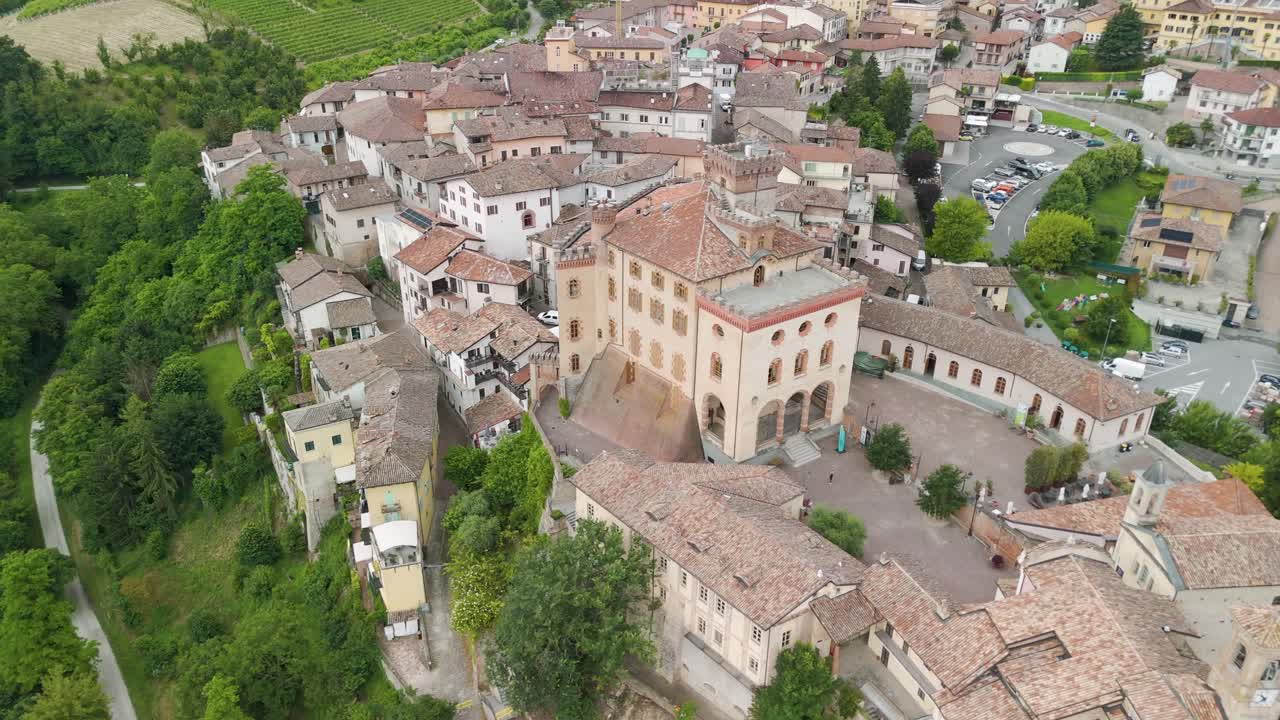 Barolo Castle in Langhe Wine Region, Cuneo, Piedmont, Italy. 4K Aerial view of the village and the vineyards. Circling to the right, castle and the town.