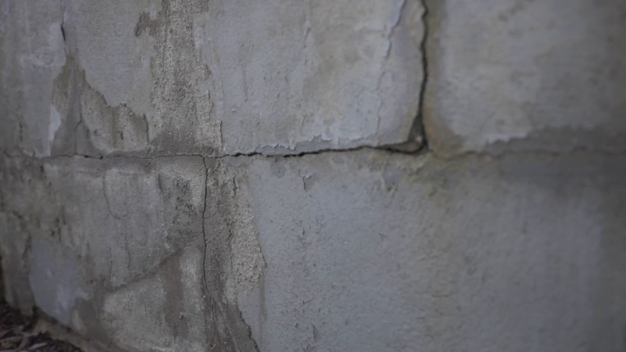 Cracks Of An Old Concrete Wall. - close up shot