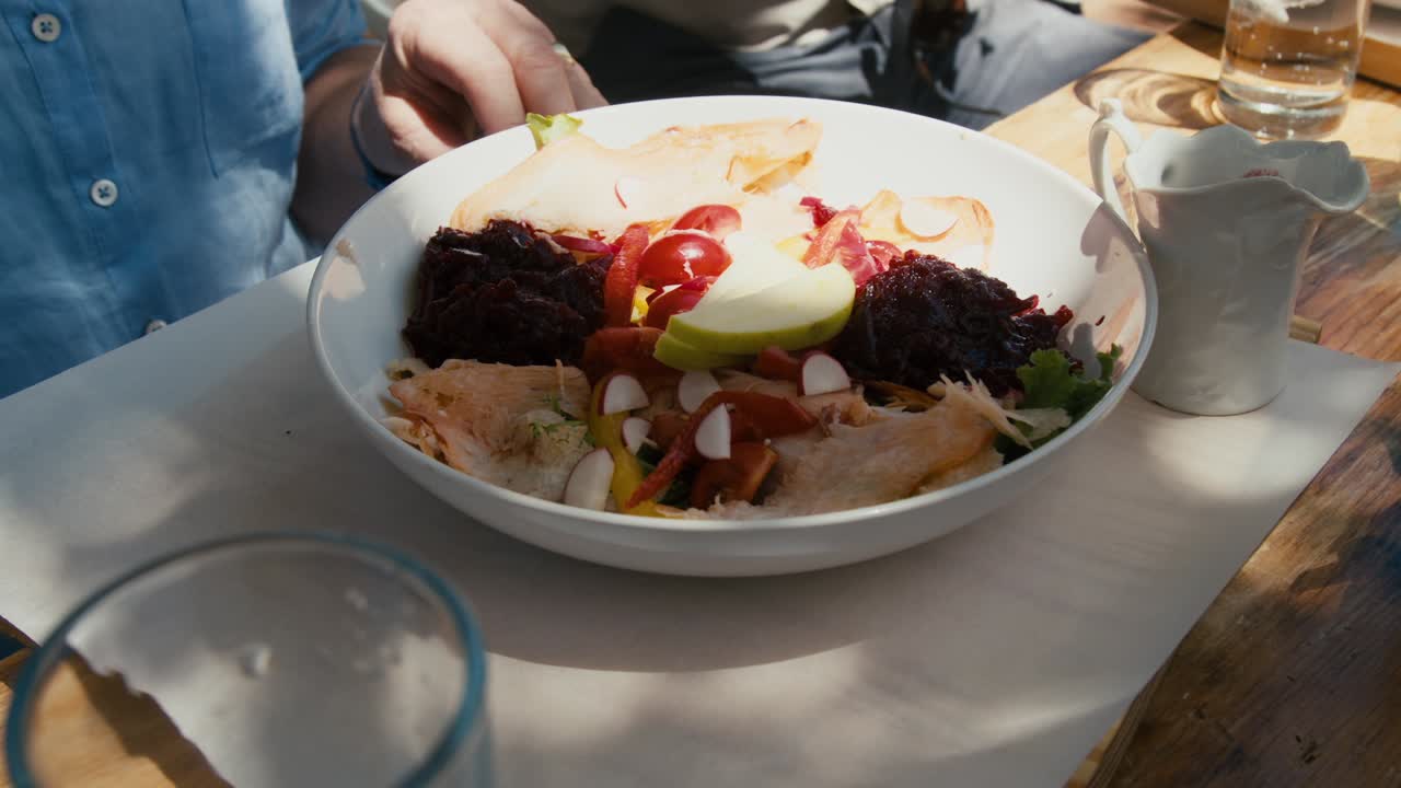 Plate of chicken salad served on a late afternoon