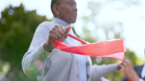 senior, black woman and nurse with stretching band