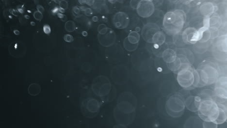 bokeh de partículas abstractas flotantes sobre fondo oscuro