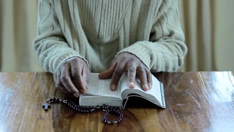 praying-to-God-with-bible-faithfully-worshipping-with-people-stock-footage-stock-video