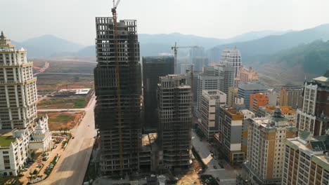 slow rising shot of buildings under construction in the boten special economic zone