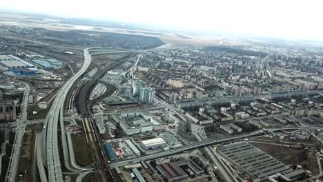 aerial view of urban cityscape with highways and infrastructure