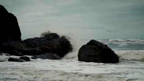 waves crashing on rocks on the shoreline