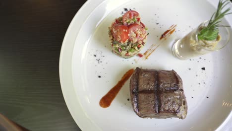 lomo steak accompanied by a quinoa salad, a delectable and wholesome combination of flavors and textures