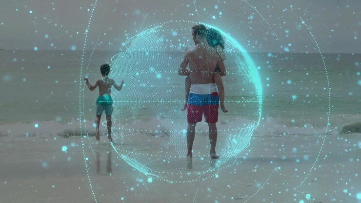 Father holding child at shore watching as child running to surf, teal tech globe overlay rotating