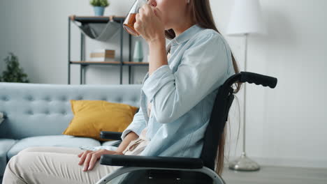 woman in wheelchair drinking tea