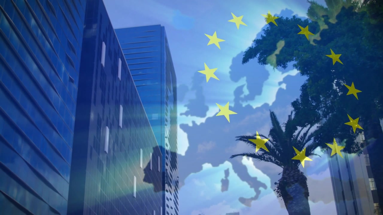 Stelle gialle che svaniscono su una mappa nuvolosa che forma un cerchio UE rotante, mentre raggi di luce spazzano il paesaggio urbano.