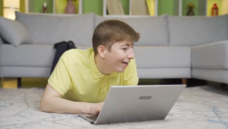 Young-man-doing-secret-work-on-laptop-at-home.