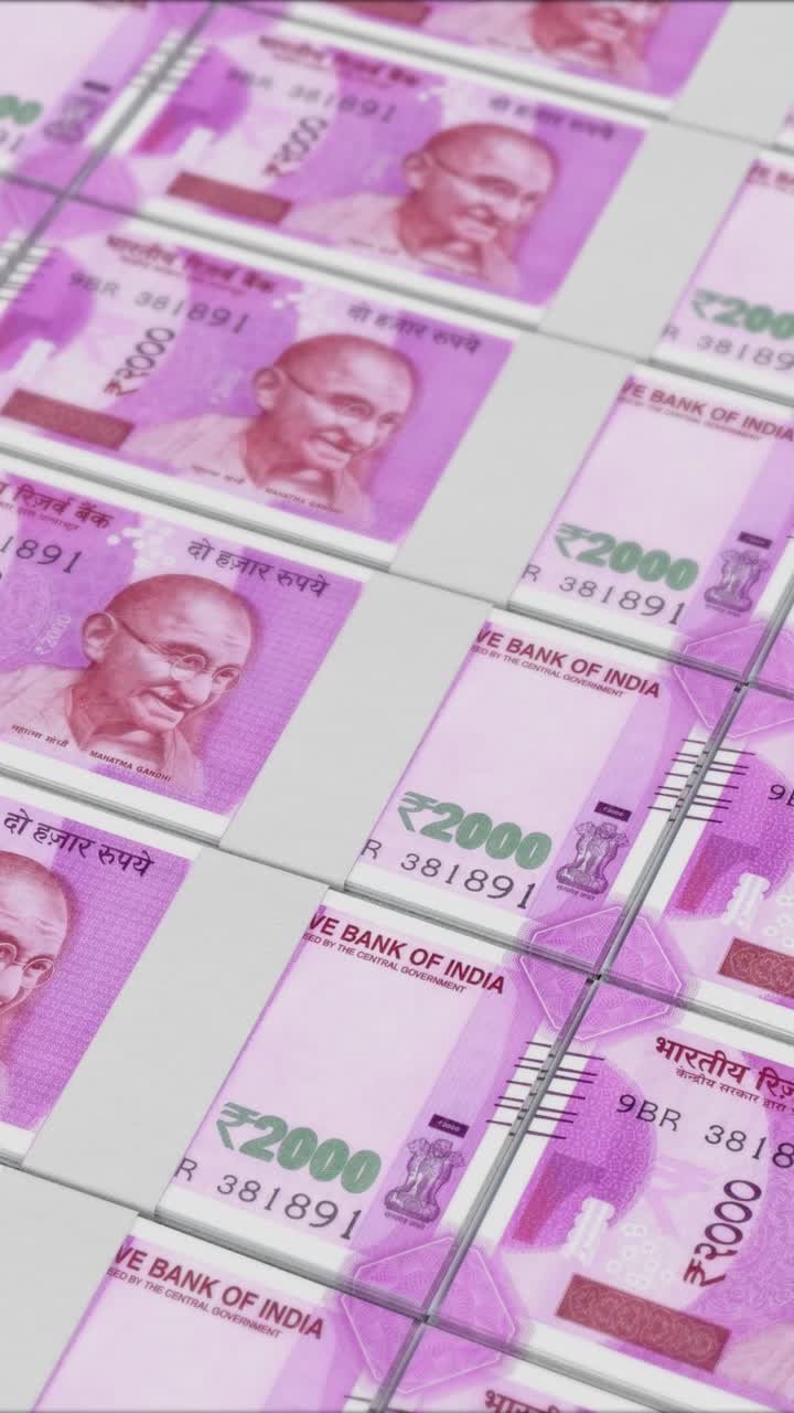Vertical video of 2000 RUPEES banknotes printing by a money press