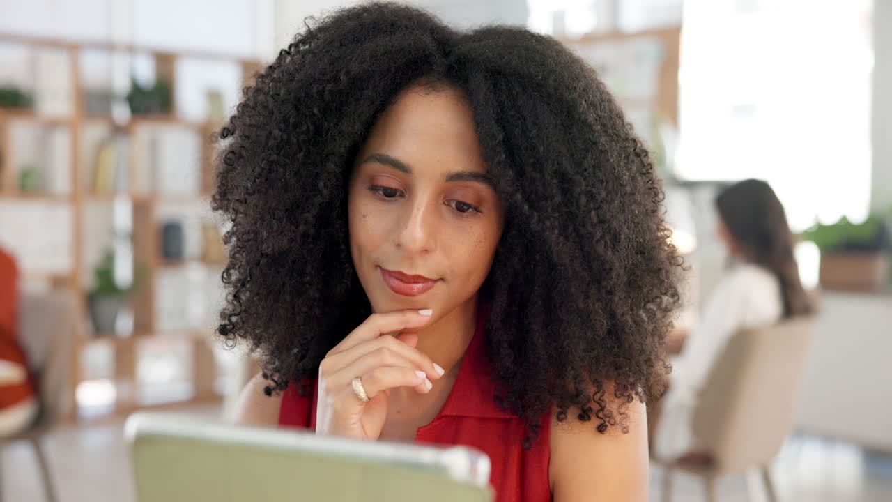 Focused Woman Working on Digital Tablet in Modern Office