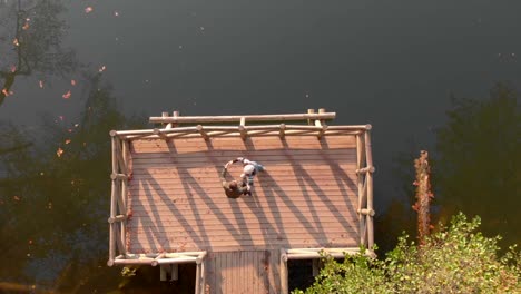 Couple-dance-in-pier-by-Yedigoller-lake,-Bulo,-Turkey