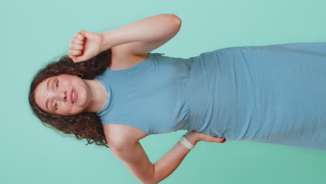 Excited young woman knocking door gesture asking who is at home feeling embarrassed no idea