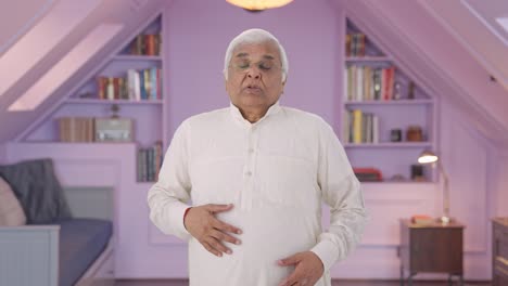 sick indian old man suffering from cold and cough