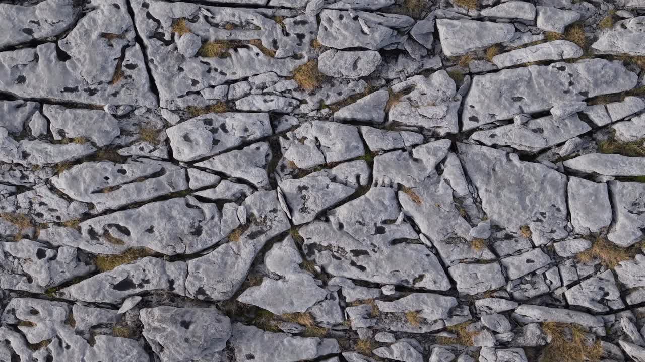 Rugged limestone landscape with cracked formations in The Burren, Ireland