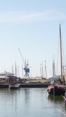 charming dutch harbour with historic vessels