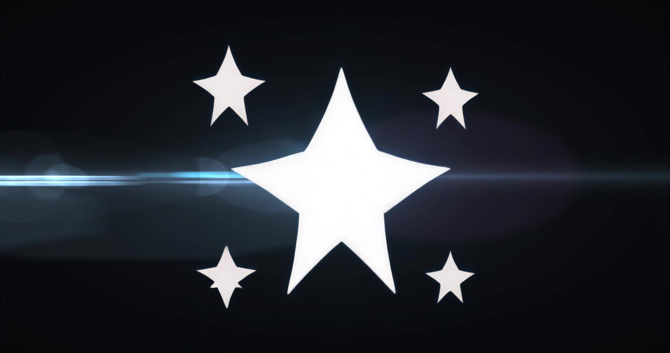 Scia di luce che si muove da sinistra, facendo mutare forma alle stelle e esaltandone lo scintillio su sfondo nero.