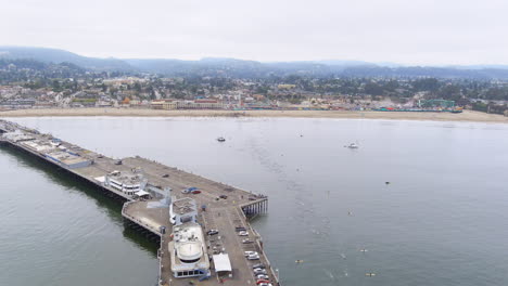 Swimmers-in-the-Pacific-Ocean-along-the-Santa-Cruz-Wharf-and-Cowell-Beach-as-part-of-a-triathlon-competition---flyover